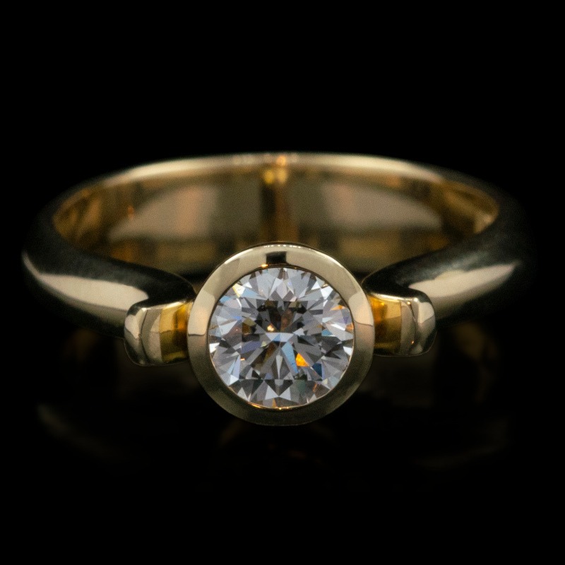 18ct yellow gold solitaire engagement ring with bezel set diamond by Rudolf Heltzel
