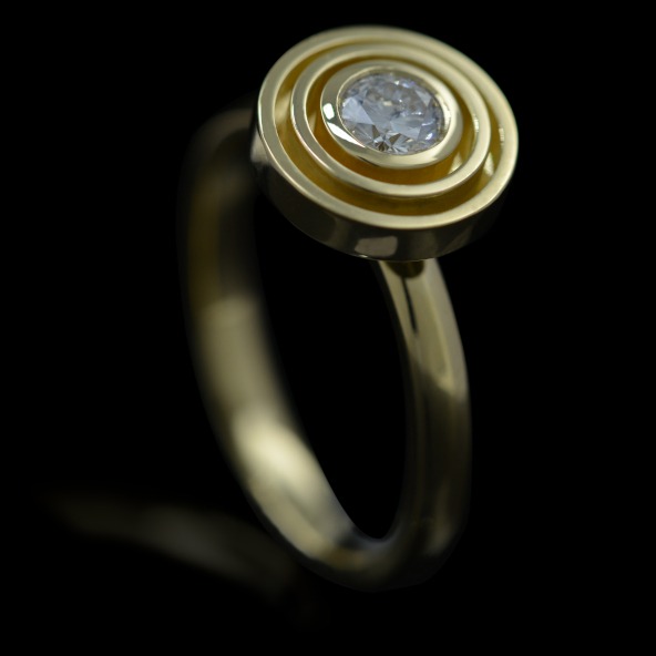 Rudolf Heltzel Handcrafted solitaire diamond engagement ring with double surround in 18ct yellow gold