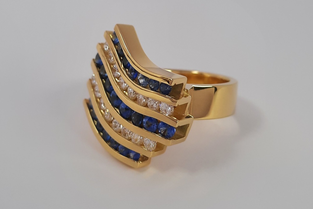 Rudolf Heltzel 18ct yellow gold ring set with faceted cut diamonds and sapphires