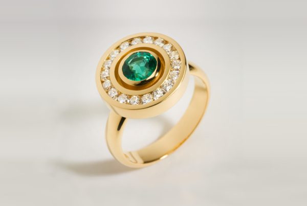 Rudolf Heltzel Diamond Surrounded Emerald 18ct Yellow Gold Engagement Ring