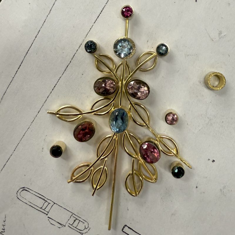 Rudolf Heltzel multi gemstone 18ct yellow gold pendant being assembled in the workshop