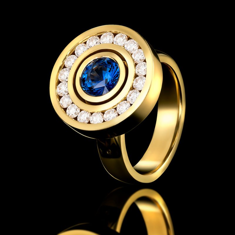 Rudolf Heltzel Diamond Surrounded Sapphire 18ct Yellow Gold Engagement Ring