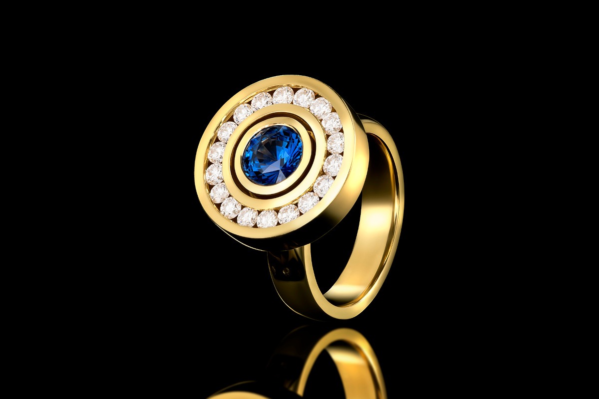 Rudolf Heltzel Diamond Surrounded Sapphire 18ct Yellow Gold Engagement Ring