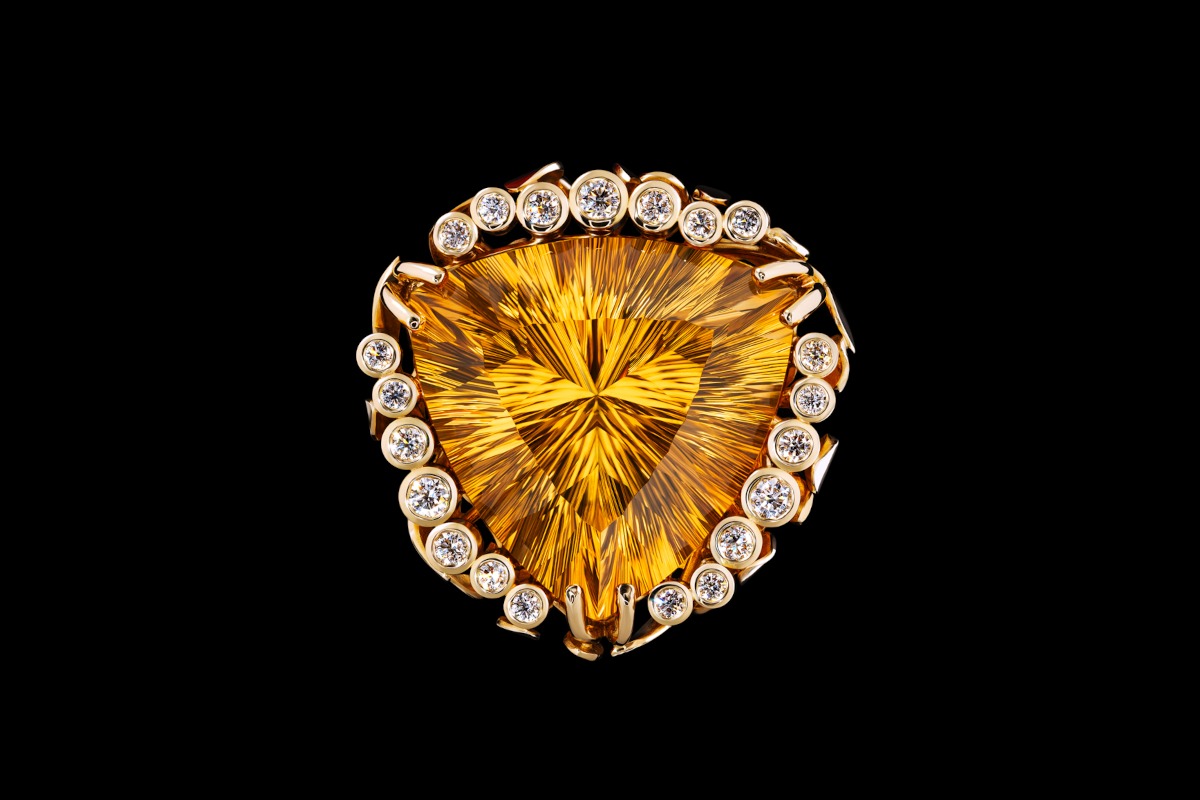 Handcrafted citrine ring in8ct yellow gold with brilliant cut diamond surround