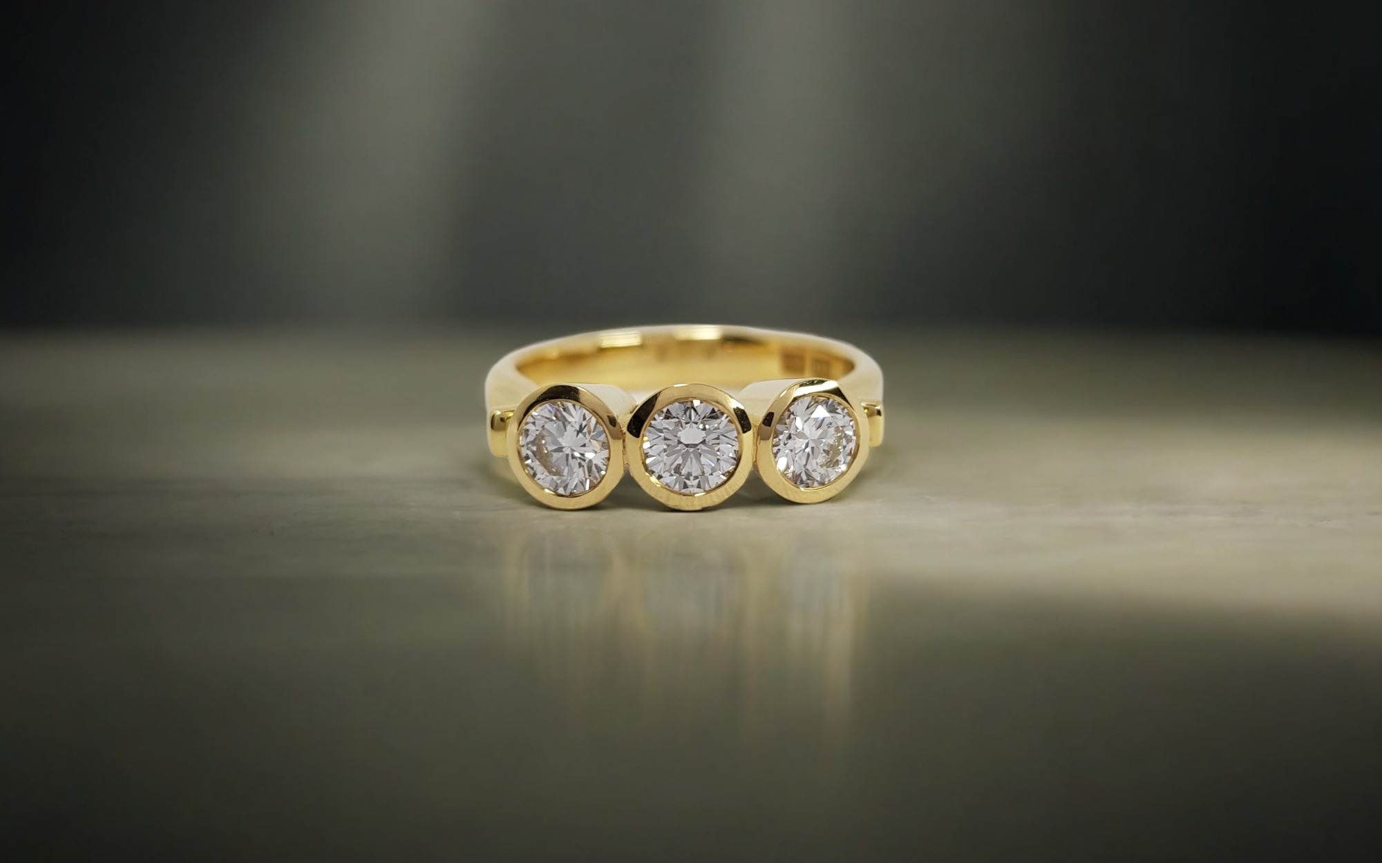 Rudolf Heltzel 3 Stone Bezel Set Engagement Ring In Yellow Gold