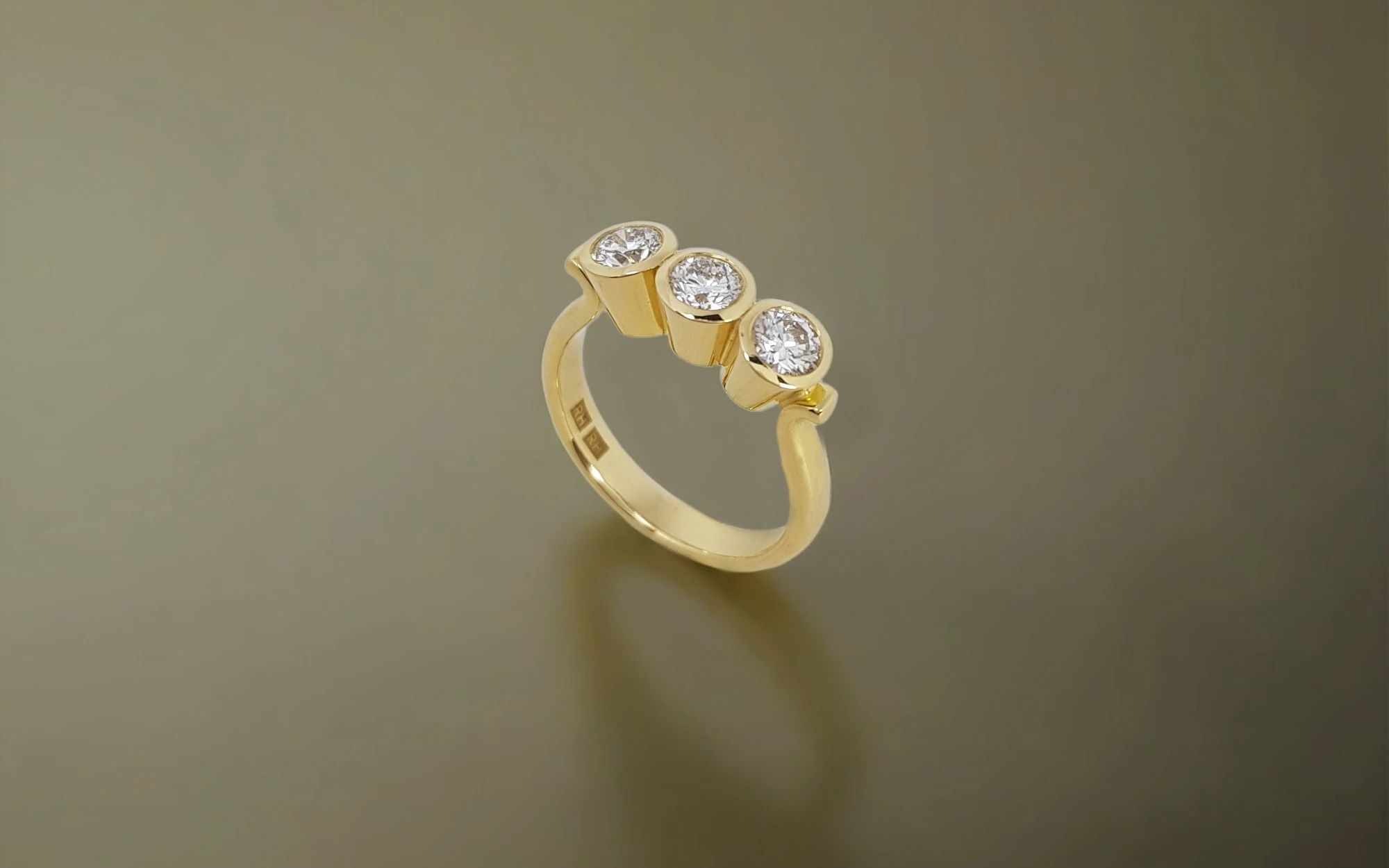 Rudolf Heltzel 3 Stone Bezel Set Engagement Ring In Yellow Gold