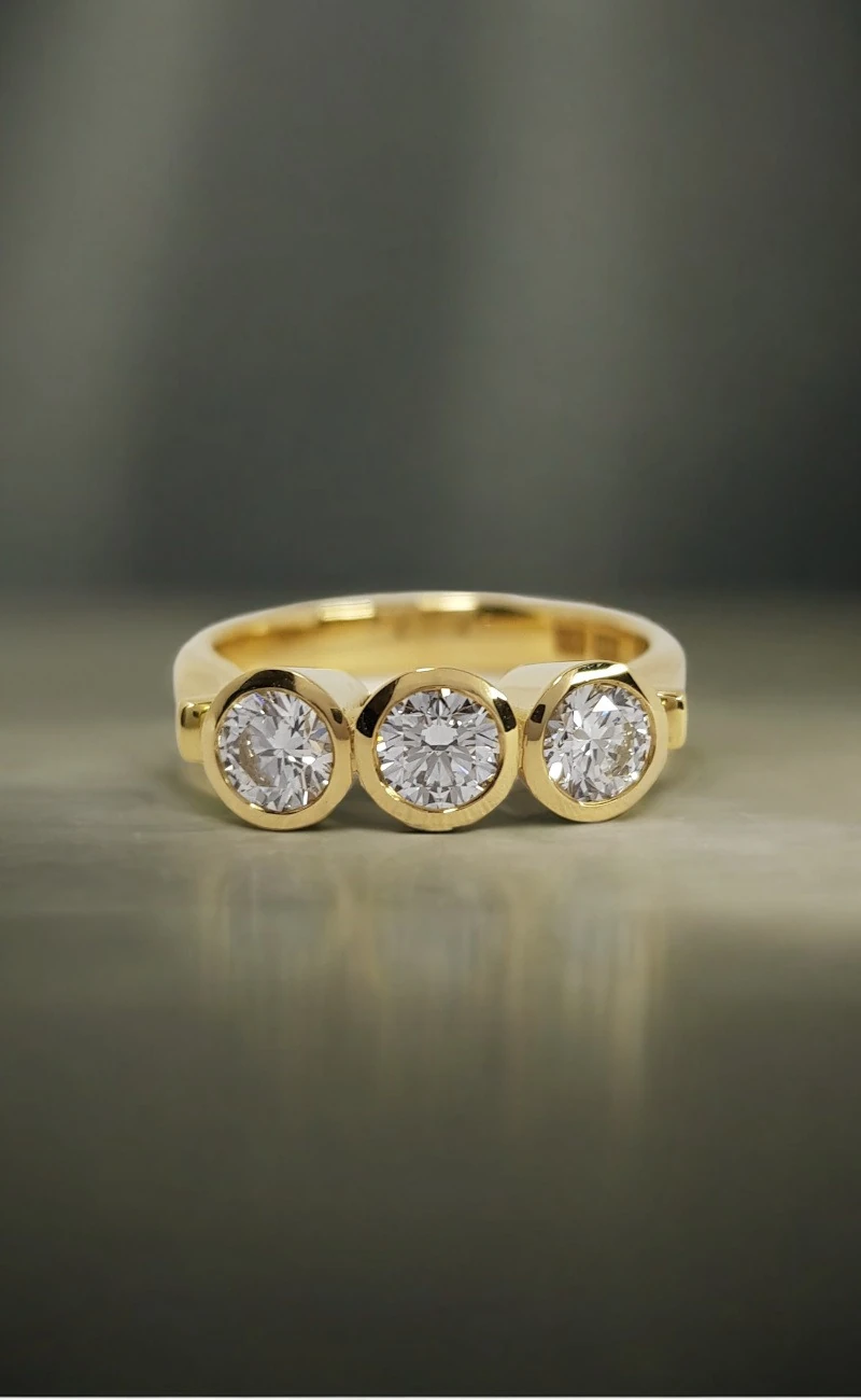 Rudolf Heltzel 3 Stone Bezel Set Engagement Ring In Yellow Gold